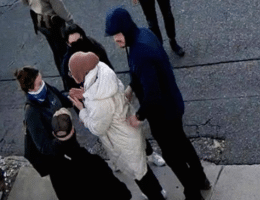 Turkish national Rumeysa Ozturk being detained by ICE agents.